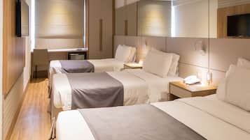 Standard Triple Room | Minibar, in-room safe, desk, blackout curtains