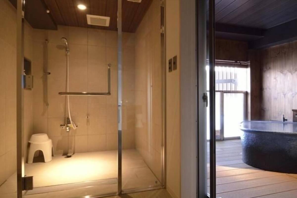 shower, hair dryer, slippers, bidet