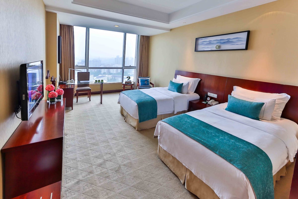 Habitación empresarial con 2 camas individuales | Ropa de cama de alta calidad y minibar