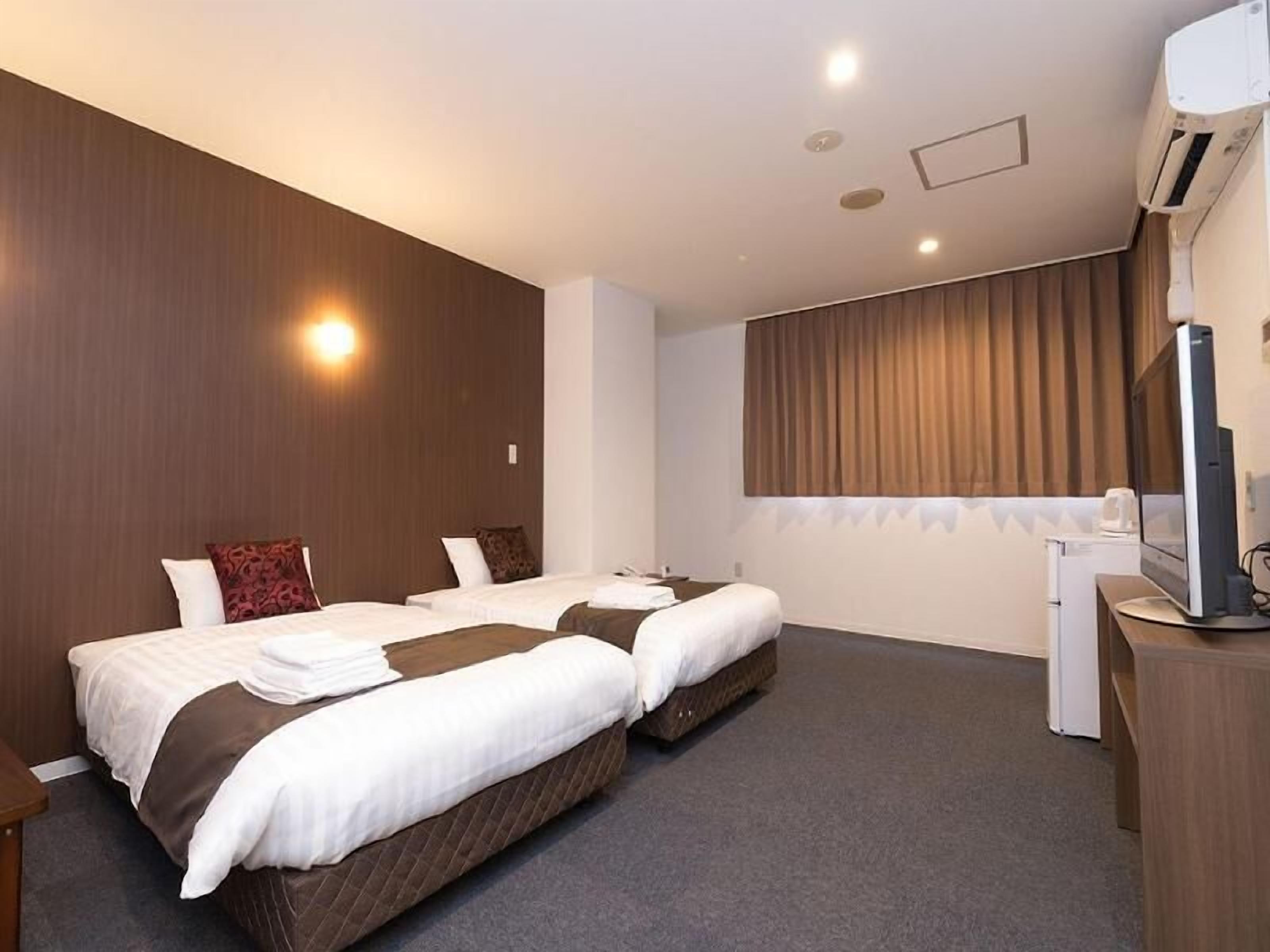 Blackout drapes, iron/ironing board, free WiFi, bed sheets