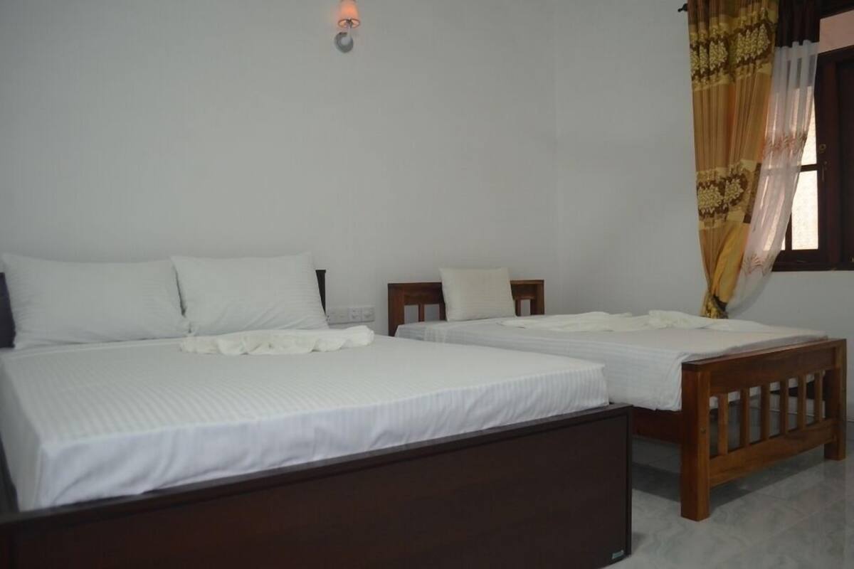 Quadruple Room | Minibar, in-room safe, desk, iron/ironing board