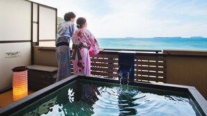 A view of a water feature with a wooden deck and a distant island. - Resort Hotel Mihagi (Hagi)