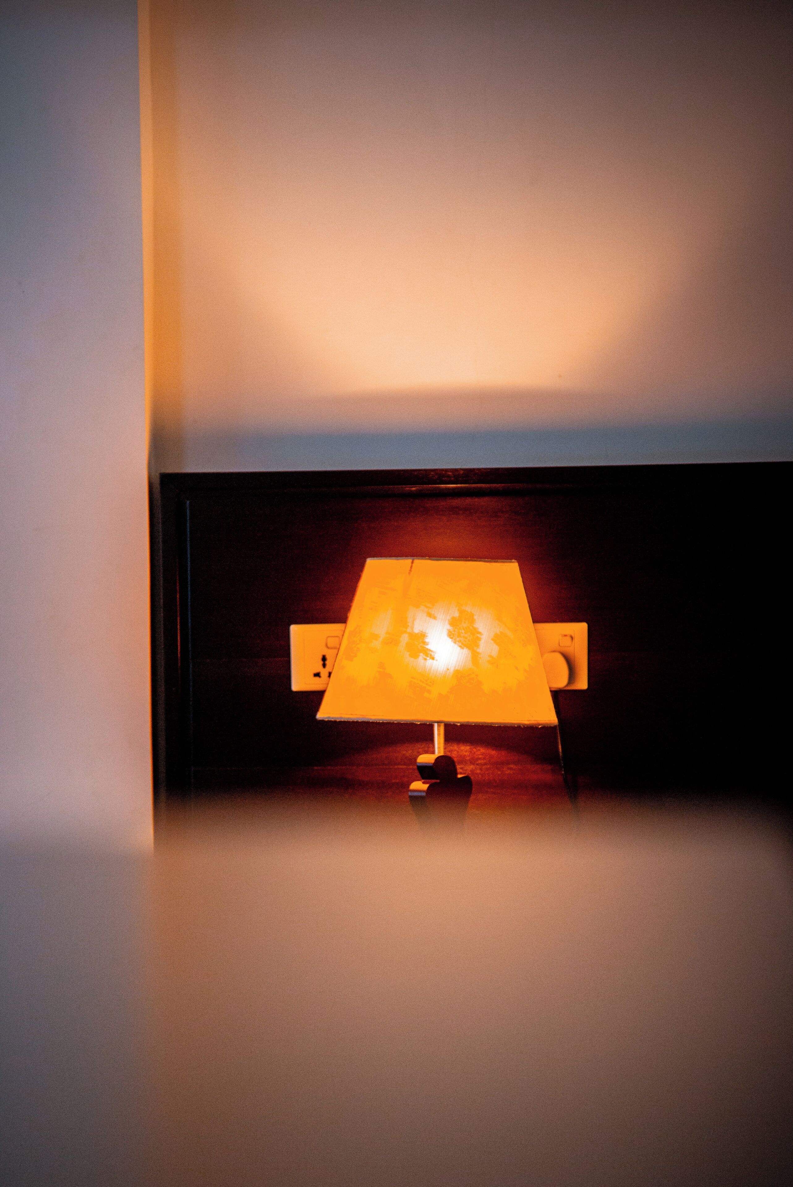 A lamp with a globe on a stand.