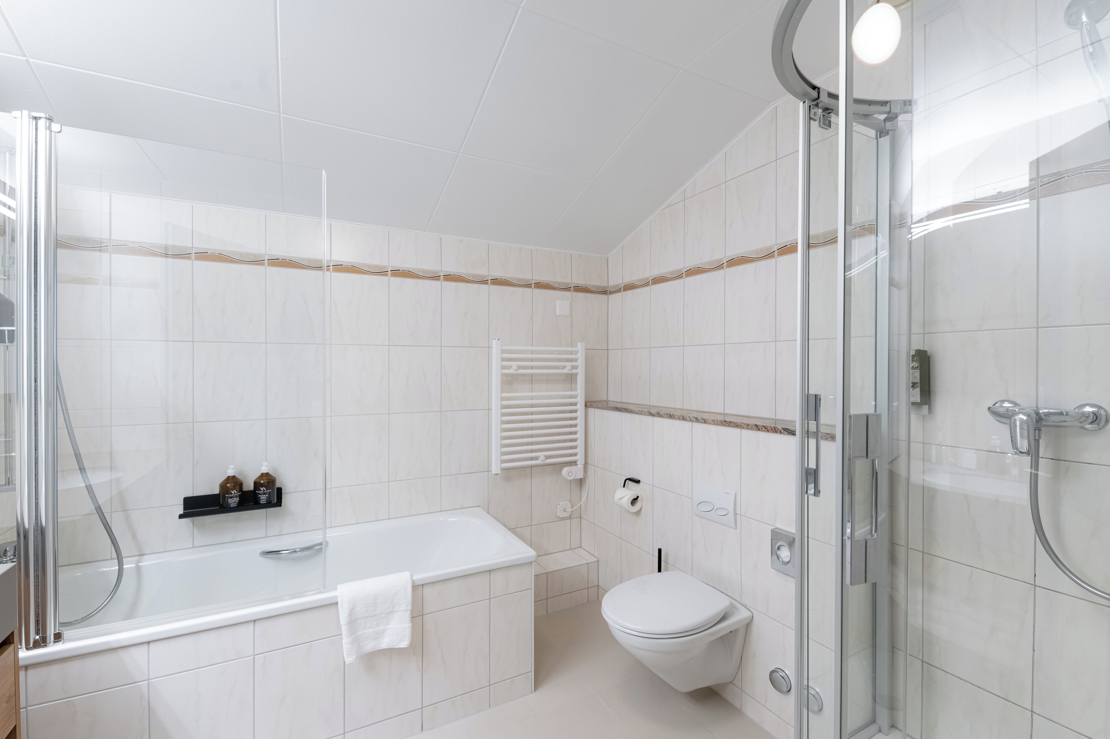 room, multiple beds (the west side apartment) | bathroom | free toiletries, hair dryer, bathrobes, slippers