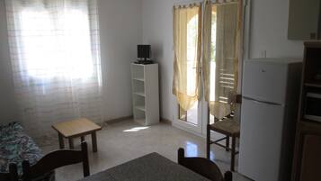 Apartment, Ground Floor | Living area | Flat-screen TV