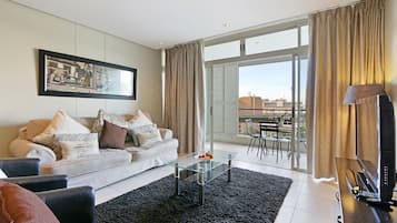 Classic Apartment, 2 Bedrooms, City View | Living room | Flat-screen TV