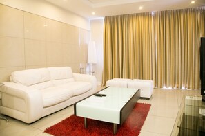 Deluxe Two-Bedroom Apartment | Living area | 32-inch LCD TV with satellite channels, TV, DVD player - Sandton Apartments Hydro (Sandton)