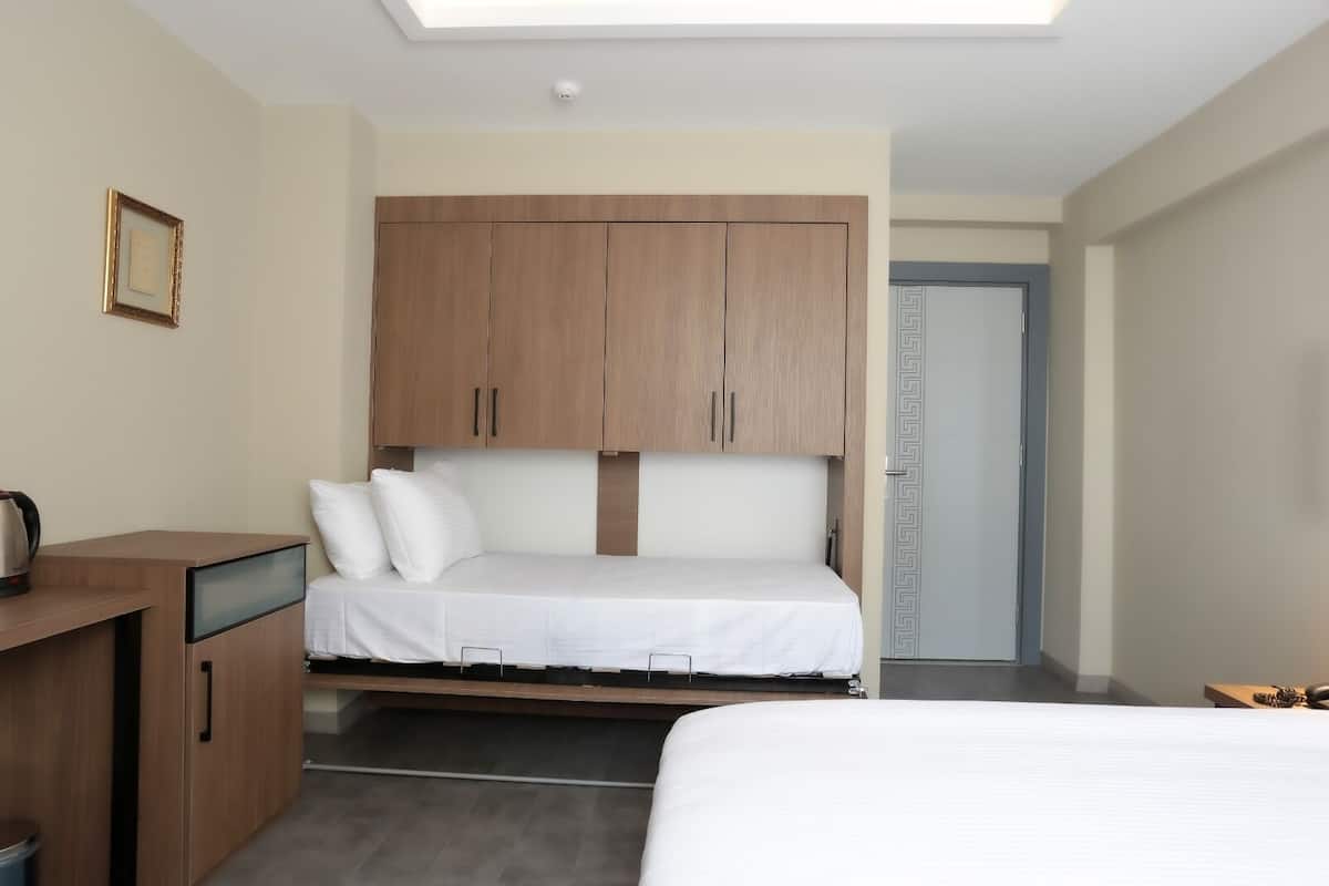 Family Quadruple Room | Minibar, in-room safe, desk, free WiFi
