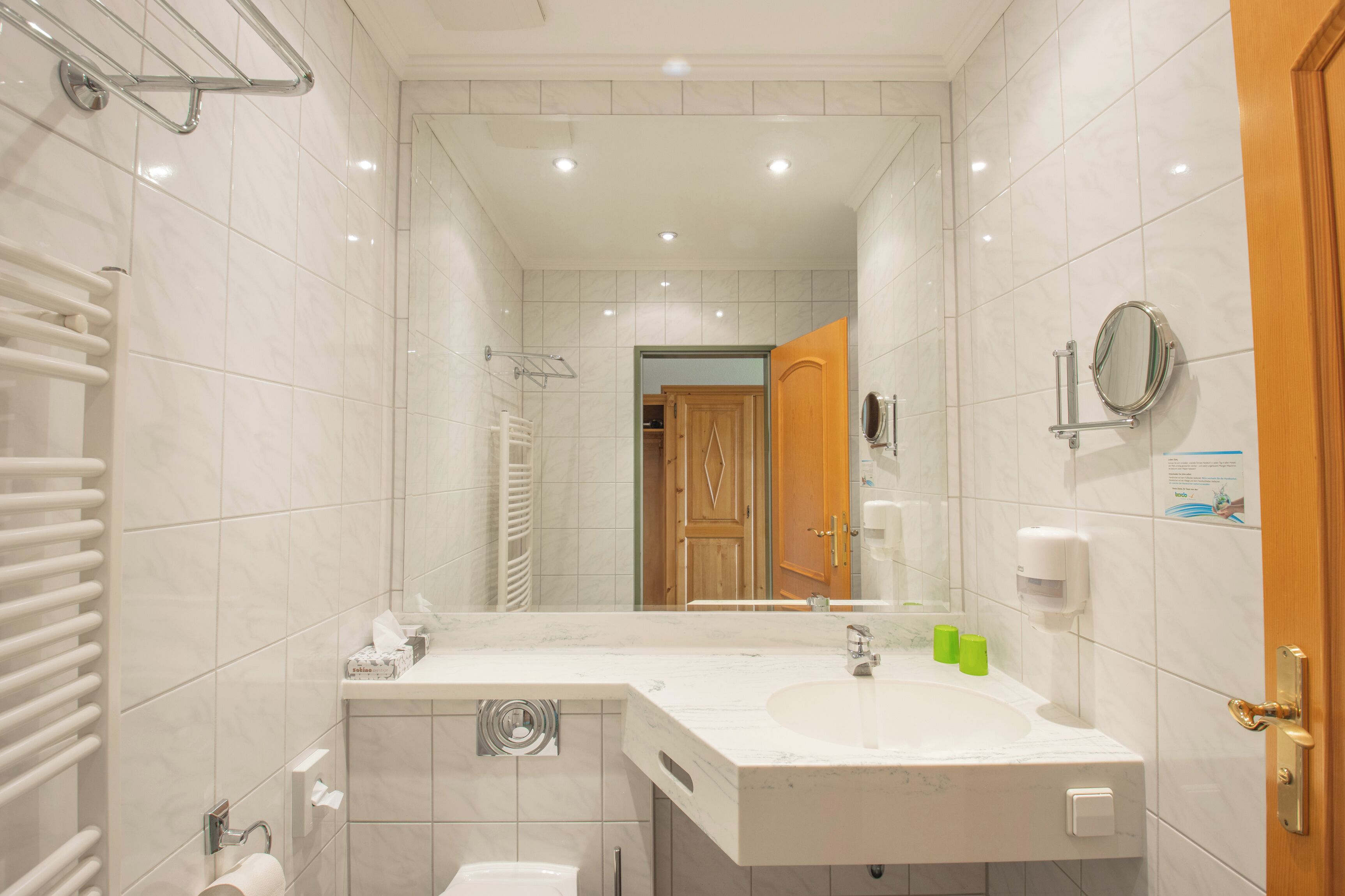 family room with connecting door | bathroom | shower, hair dryer, towels