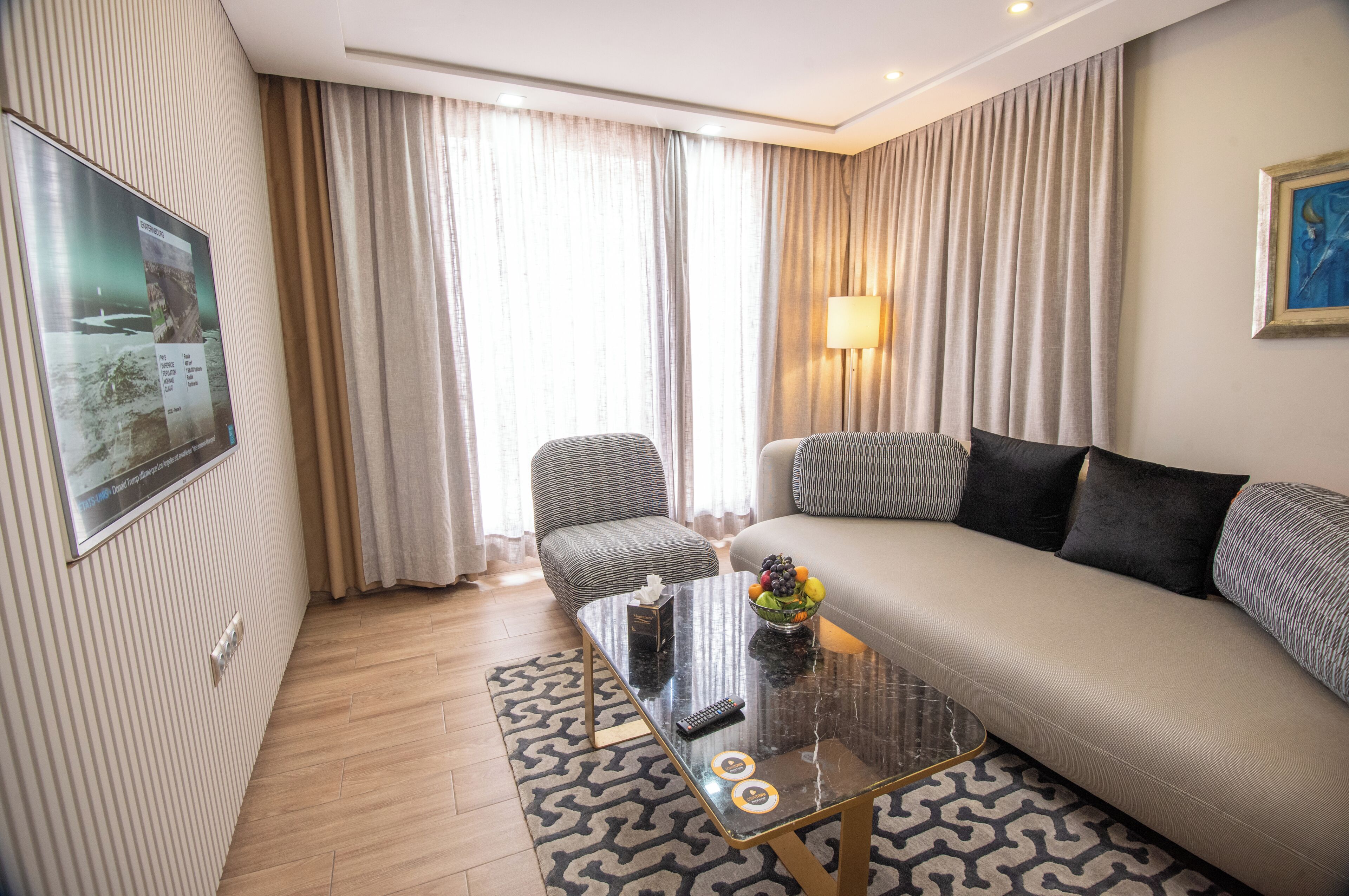 Junior Suite | Living area | 42-inch flat-screen TV with satellite channels, TV