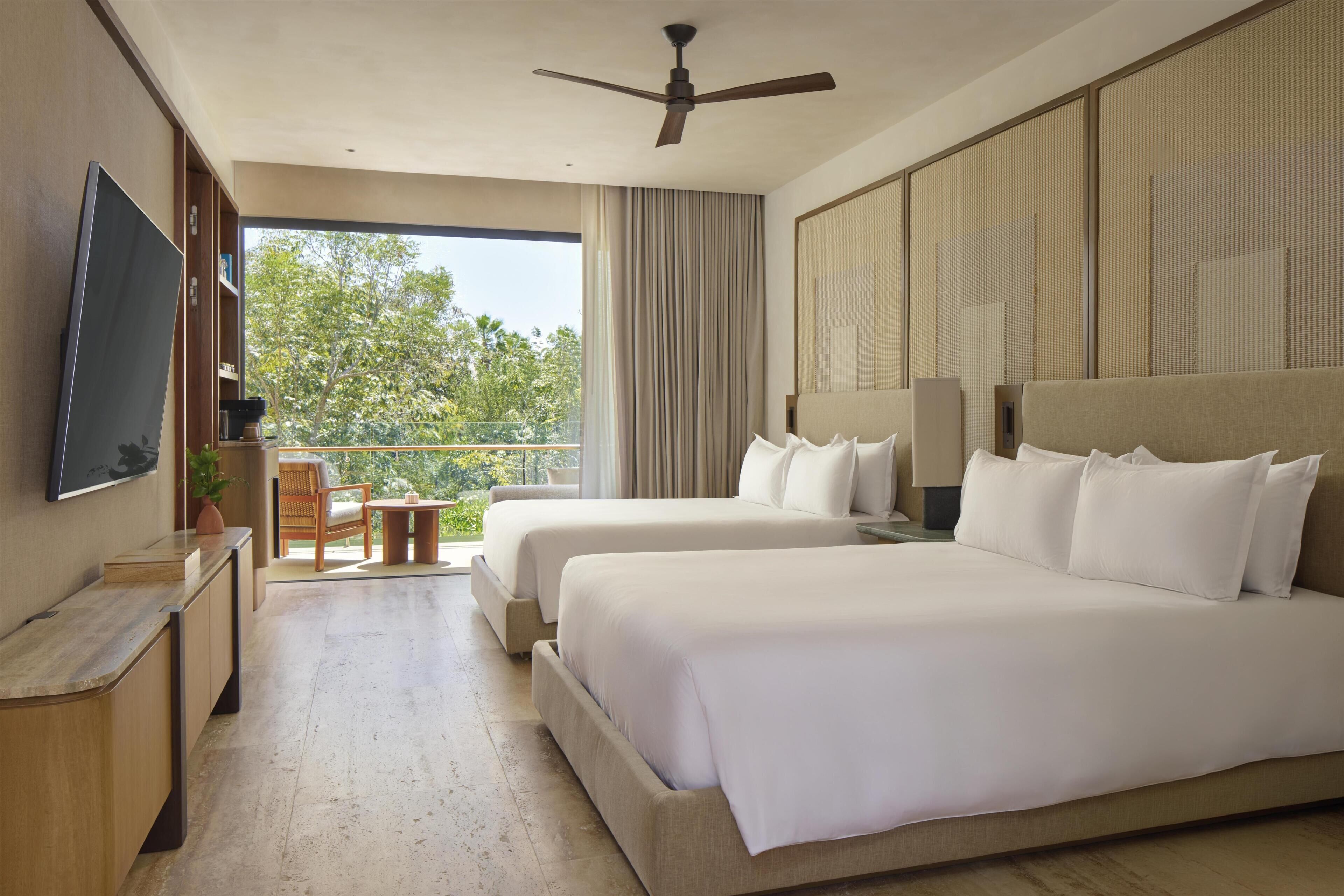 Luxe beddengoed, een minibar met enkele gratis items