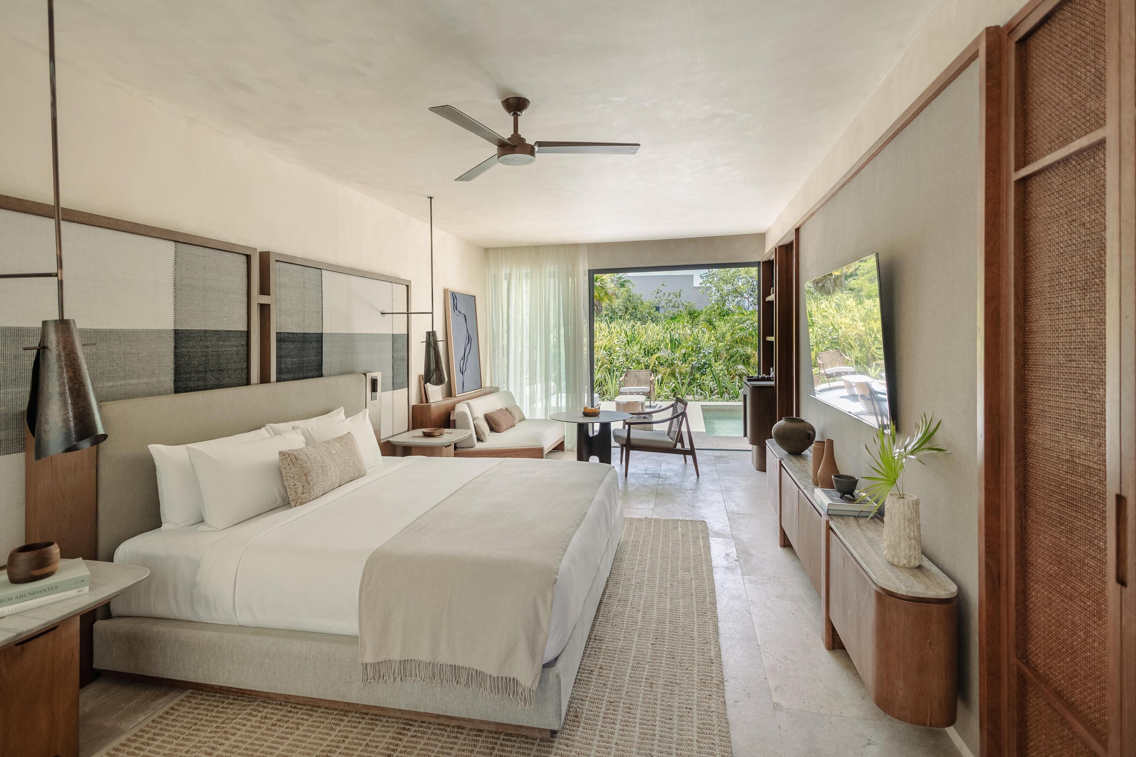 Premium bedding, free minibar items, in-room safe, laptop workspace