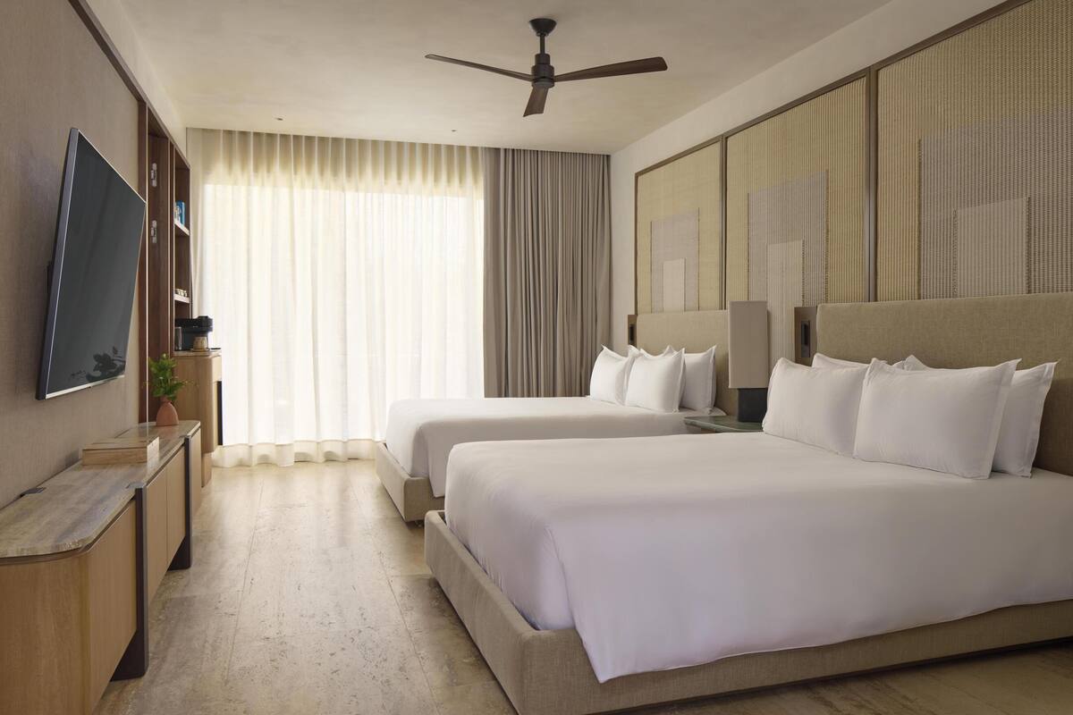 Premium bedding, free minibar items, in-room safe, laptop workspace