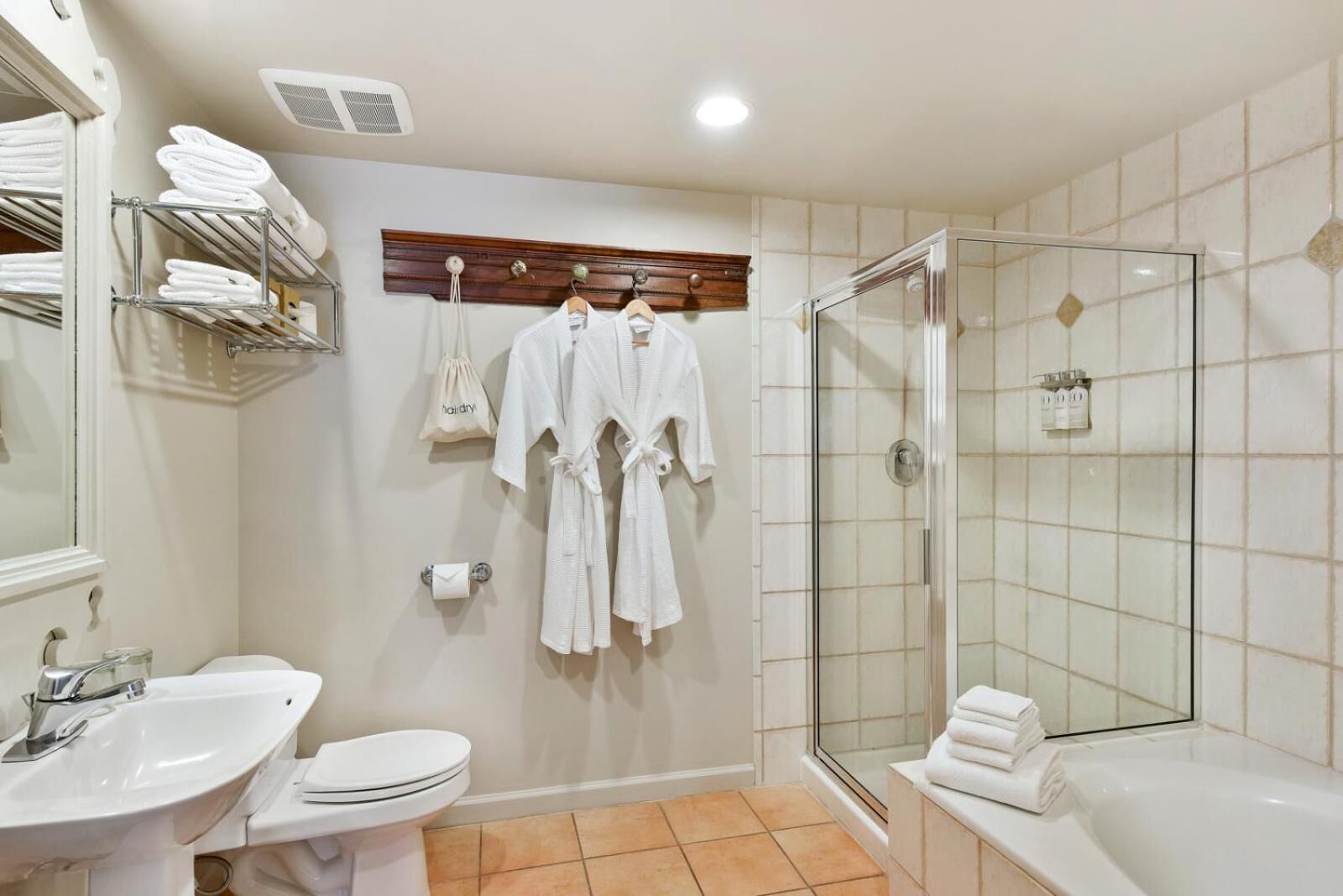 combined shower/bathtub, designer toiletries, hair dryer, bathrobes
