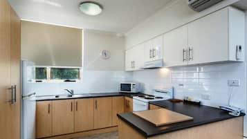 2 Bedroom Apartment | Private kitchen | Full-size fridge, microwave, oven, stovetop