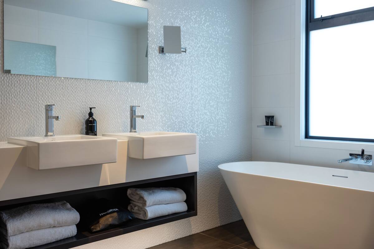 royal suite | bathroom | hair dryer, bathrobes, slippers, towels