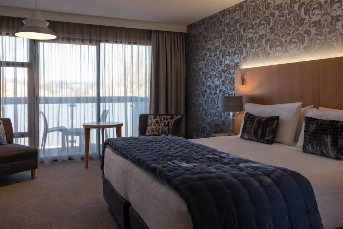 Premium bedding, desk, blackout curtains, soundproofing