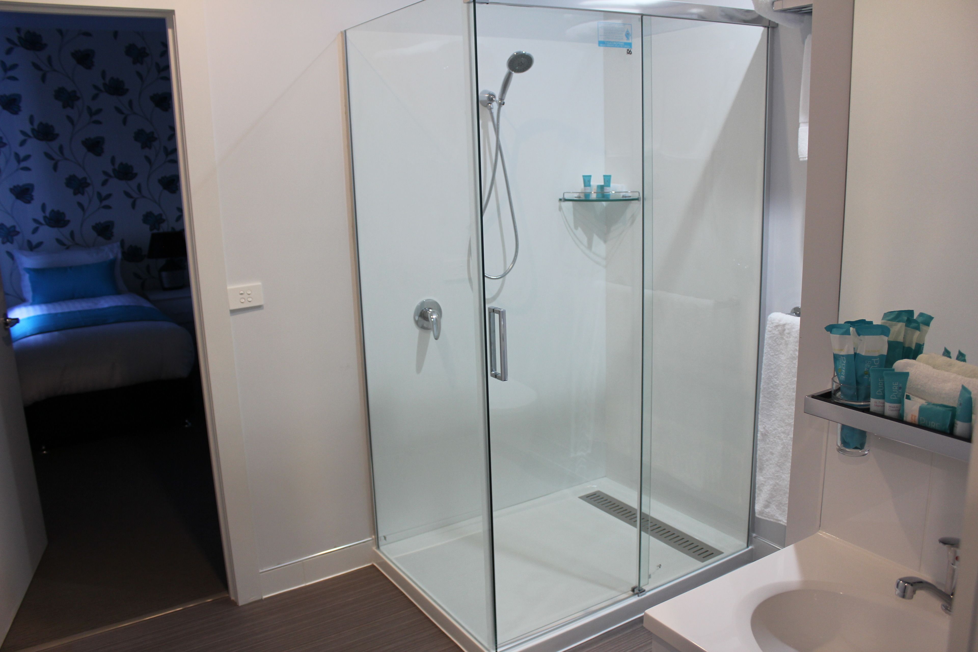 deluxe family two bedroom  | bathroom | shower, free toiletries, hair dryer, towels