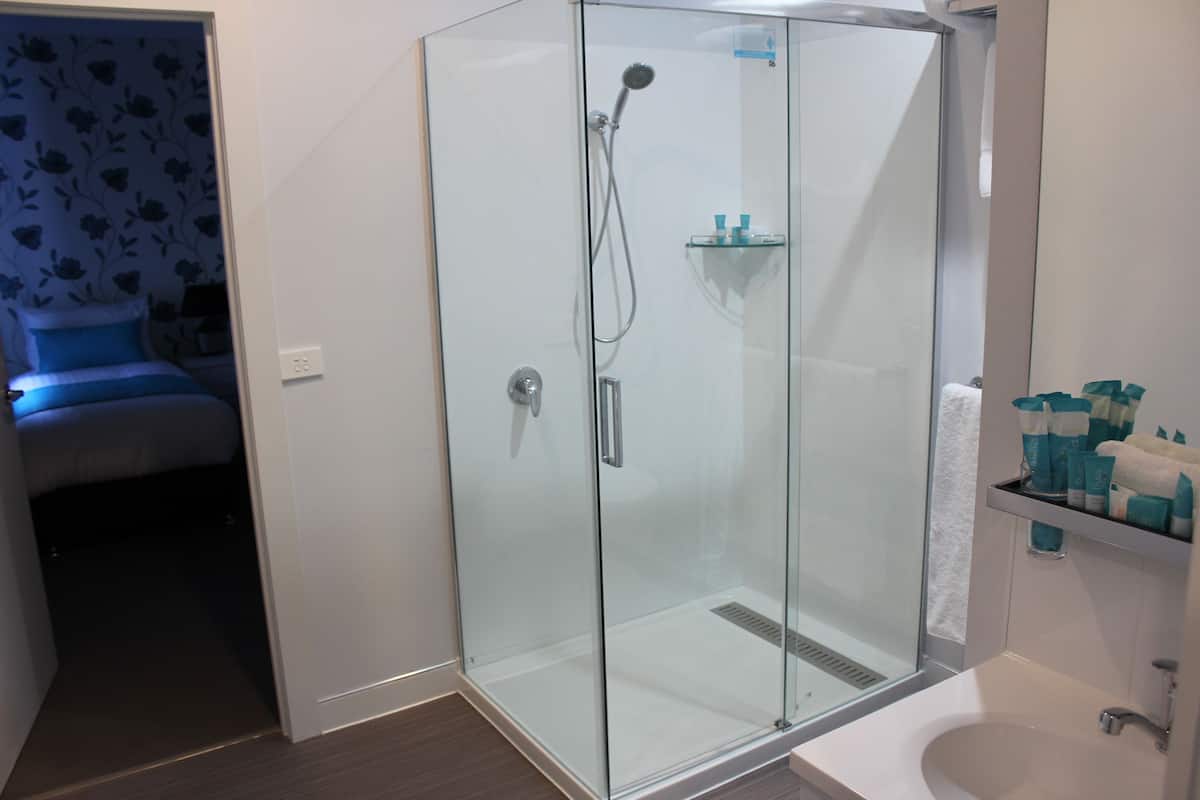 deluxe family two bedroom  | bathroom | shower, free toiletries, hair dryer, towels