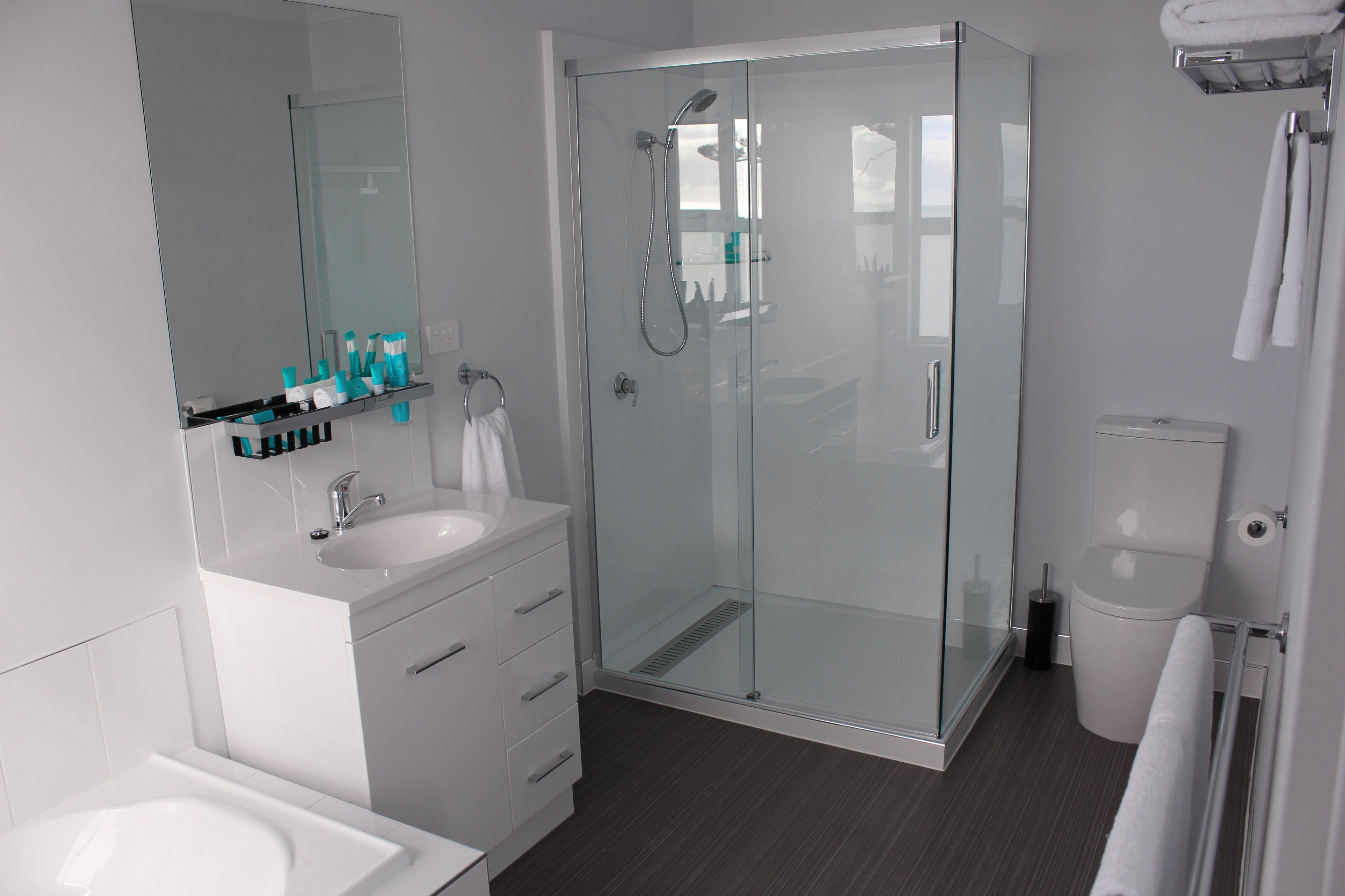 deluxe oceanfront queen  | bathroom | shower, free toiletries, hair dryer, towels