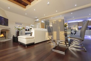 Grand Apartment, 2 Bedrooms | Living room | Flat-screen TV, DVD player