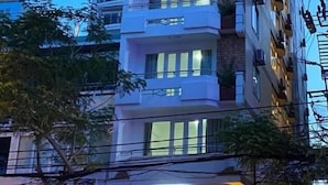 A multi-story hotel with balconies and a visible sign for Dream Hotel. - Dream Hotel Nha Trang (Nha Trang)