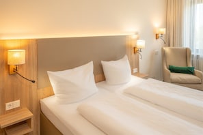 Comfort Room | Hypo-allergenic bedding, down comforters, desk, laptop workspace