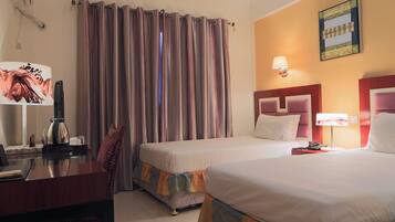 Twin Room | Minibar, in-room safe, desk, rollaway beds