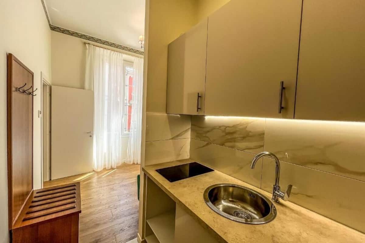 deluxe condo | private kitchen | mini-fridge, stovetop, coffee grinder, cookware/dishes/utensils