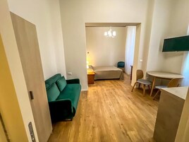 Economy Apartment | Premium bedding, down comforters, in-room safe, desk