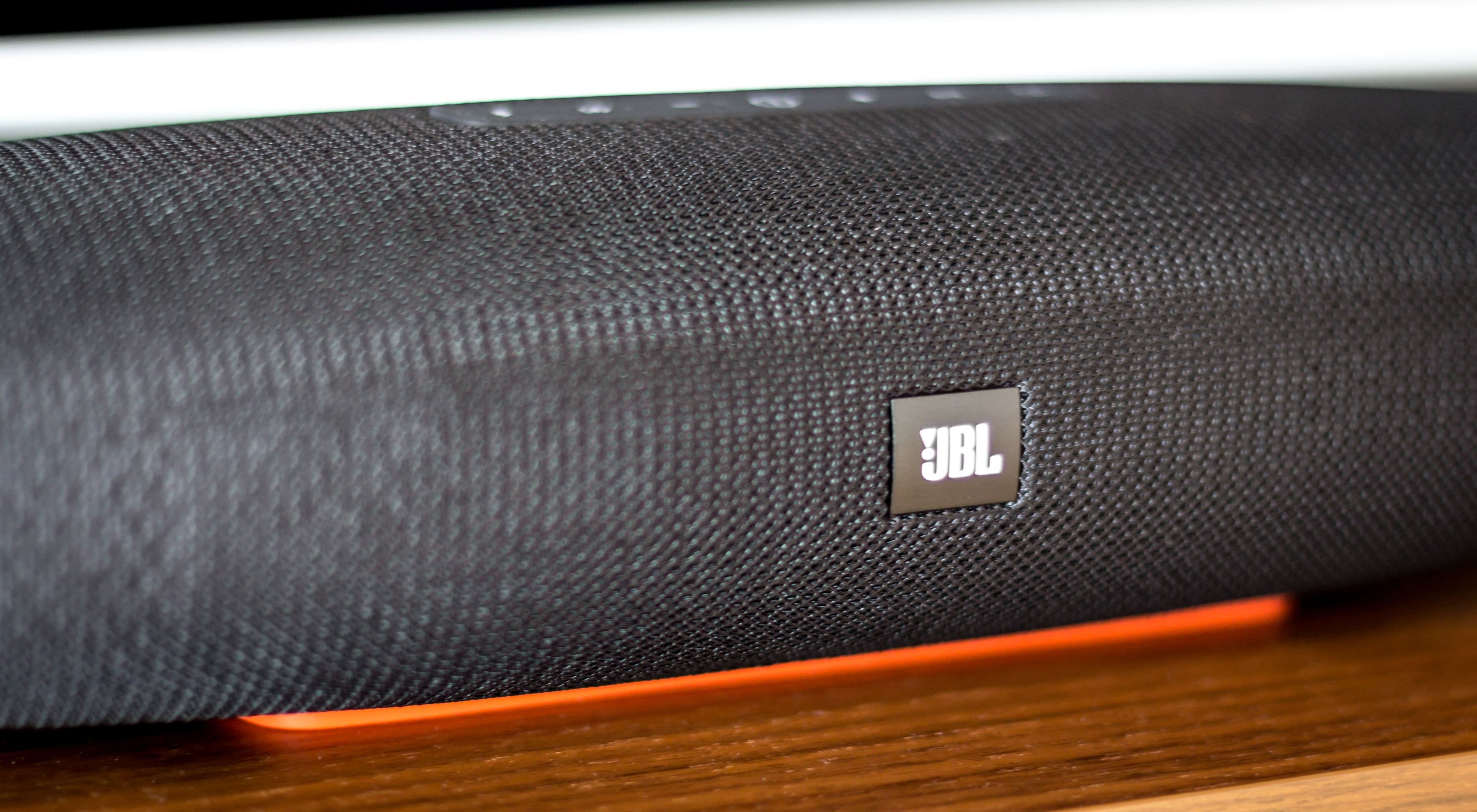 A close-up of a JBL speaker with a textured surface and a visible JBL logo.