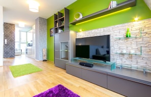 Comfort Suite One-Bedroom Apartment with Terrace | Living area | 32-inch flat-screen TV with satellite channels, TV - Abieshomes Serviced Apartments - Votivpark (Vienna)
