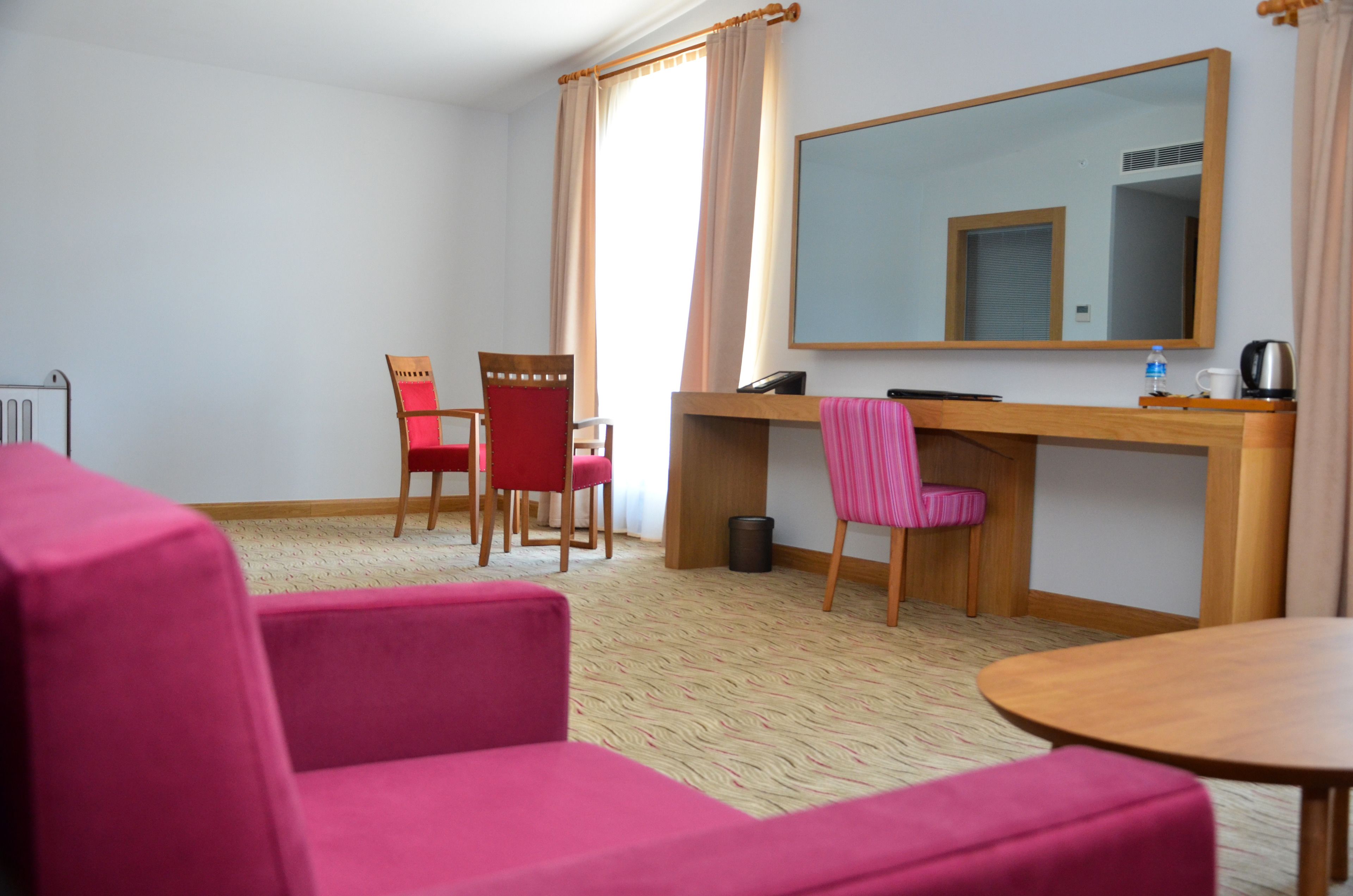 deluxe quadruple room | living area | 32-inch lcd tv with satellite channels, tv