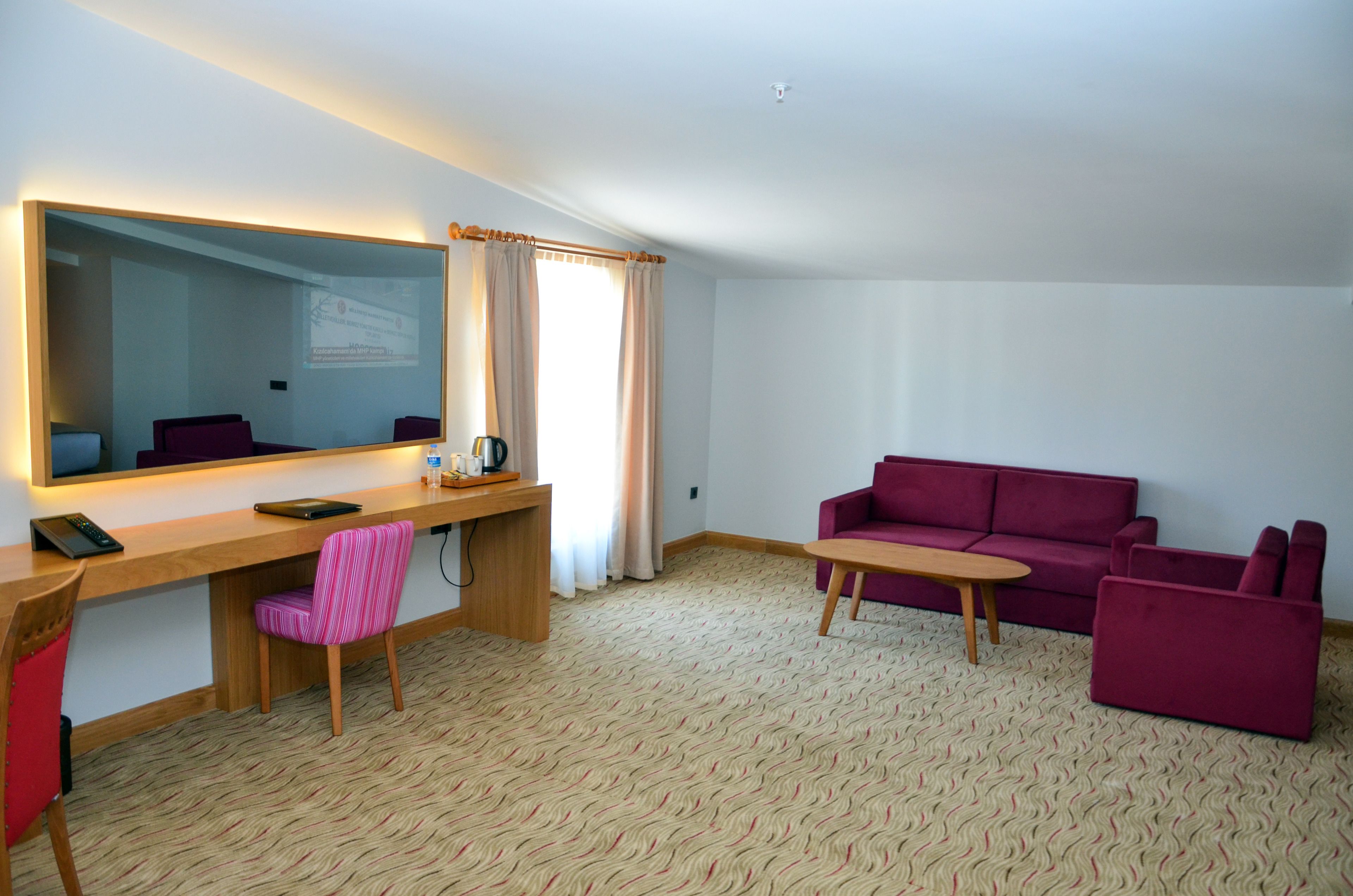 deluxe quadruple room | living area | 32-inch lcd tv with satellite channels, tv