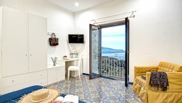 Minibar, desk, blackout curtains, iron/ironing board
