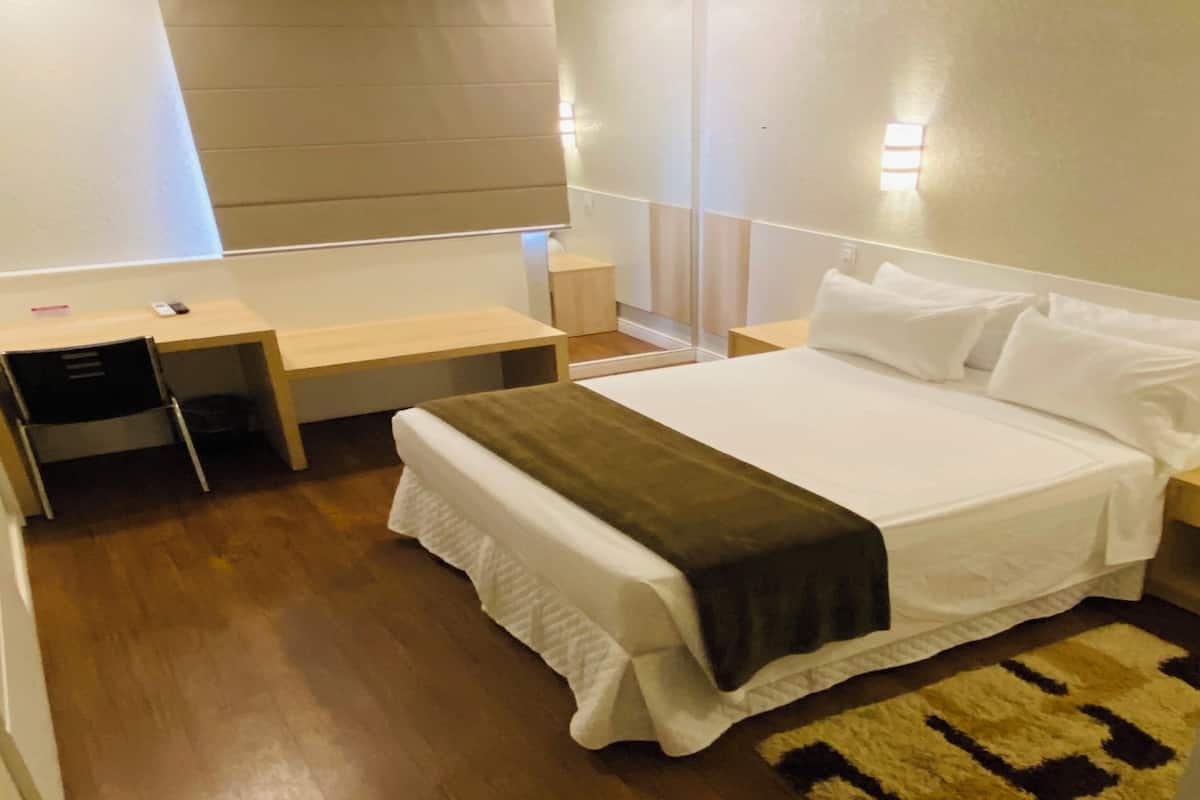 deluxe double room | minibar, in-room safe, desk, blackout curtains