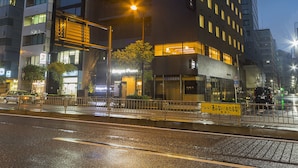 A modern building with a 'darmy inn' sign, featuring multiple floors and a prominent entrance. - Dormy Inn Premium Tokyo Kodenmacho Hot Spring (Tokyo)