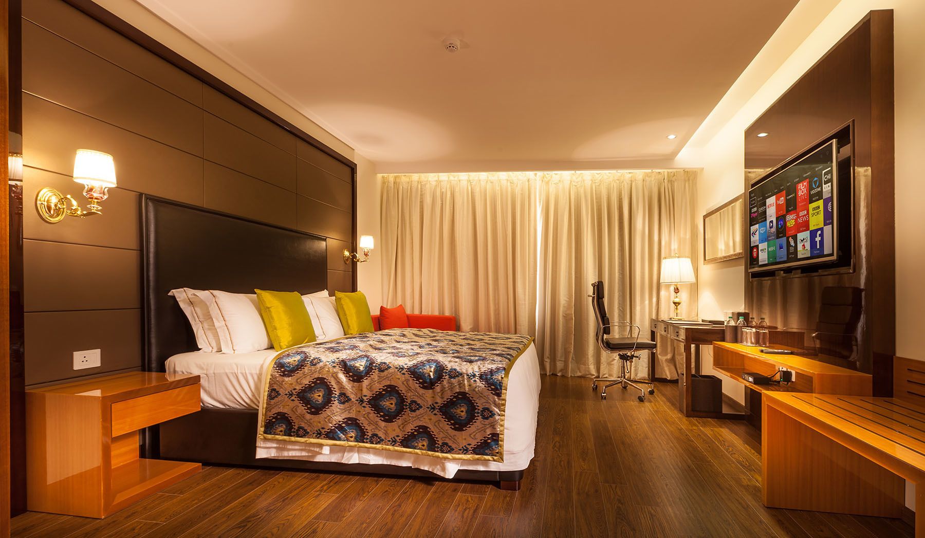 junior suite | in-room safe, desk, blackout curtains, soundproofing