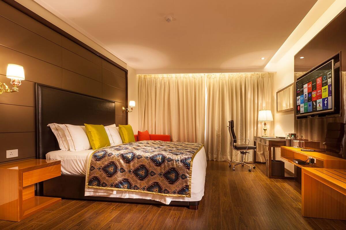 junior suite | in-room safe, desk, blackout curtains, soundproofing