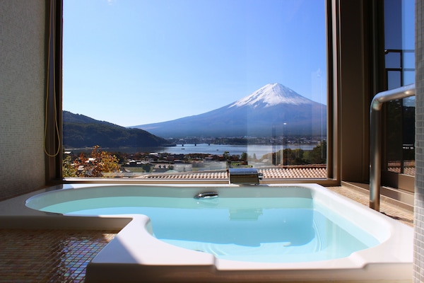 Separate bathtub and shower, free toiletries, hair dryer, slippers