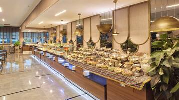 A buffet with various food items and a long counter.
