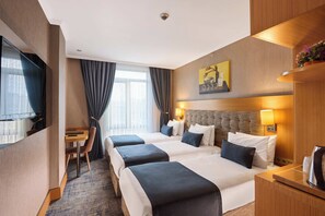 Standard Triple Room | Minibar, in-room safe, desk, rollaway beds