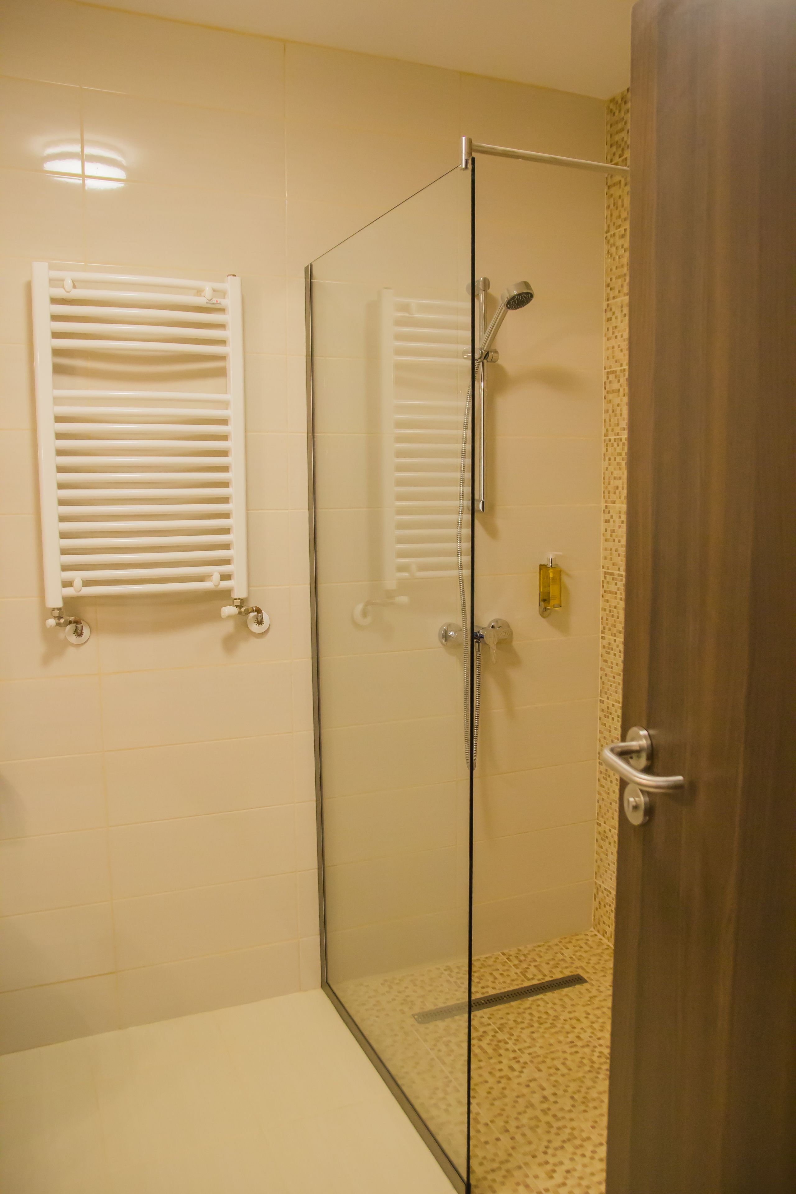 standard twin room | bathroom | shower, free toiletries, hair dryer, dressing gowns