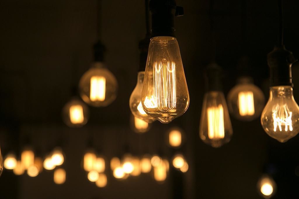 A series of hanging light bulbs with a warm glow.