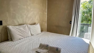 Blackout curtains, iron/ironing board, bed sheets