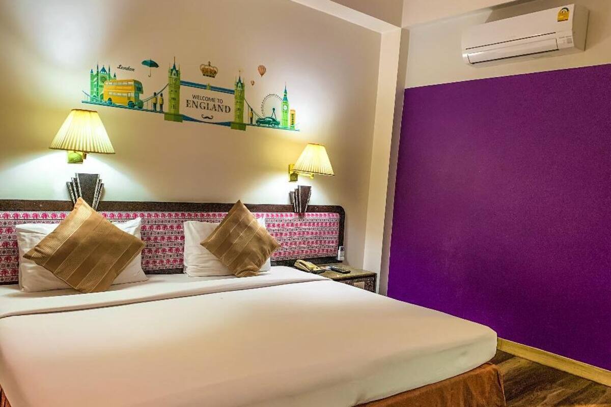 deluxe room, air conditioner | 1 bedroom, desk, laptop workspace, blackout curtains