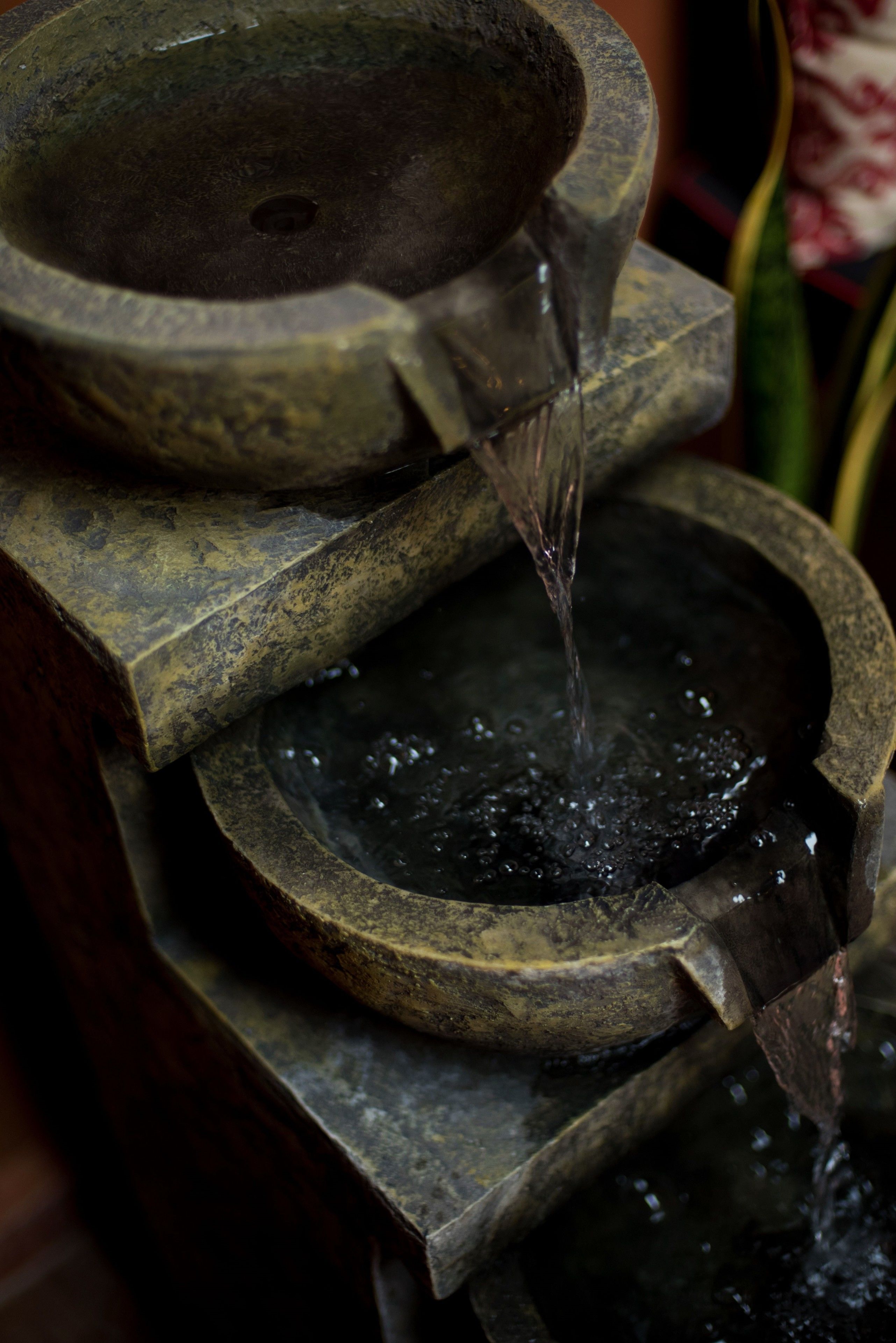 A stone water feature with cascading water.