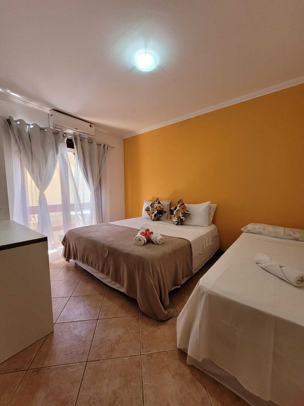 Frigobar, cortinas blackout, Wi-Fi de cortesia, roupa de cama