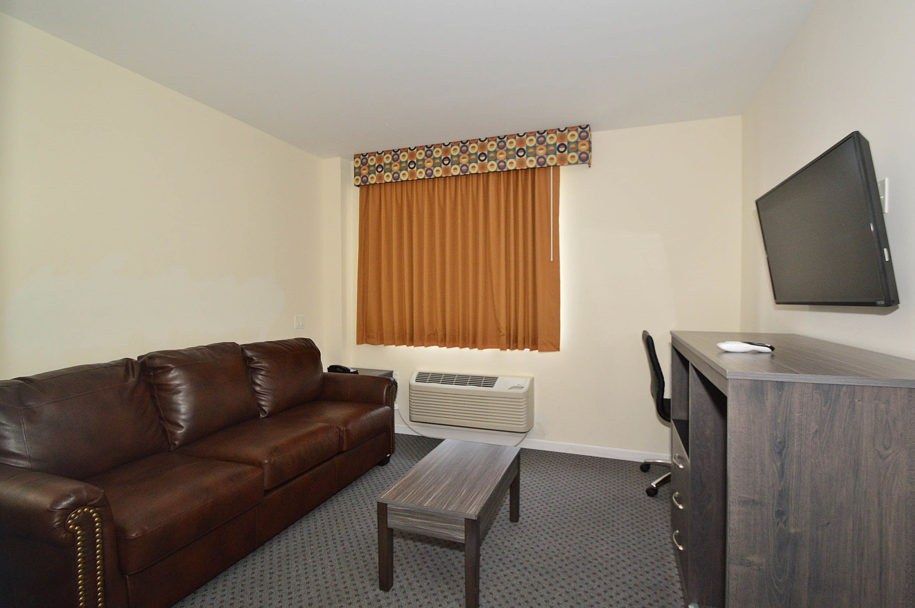 Deluxe Suite | Living room | Flat-screen TV