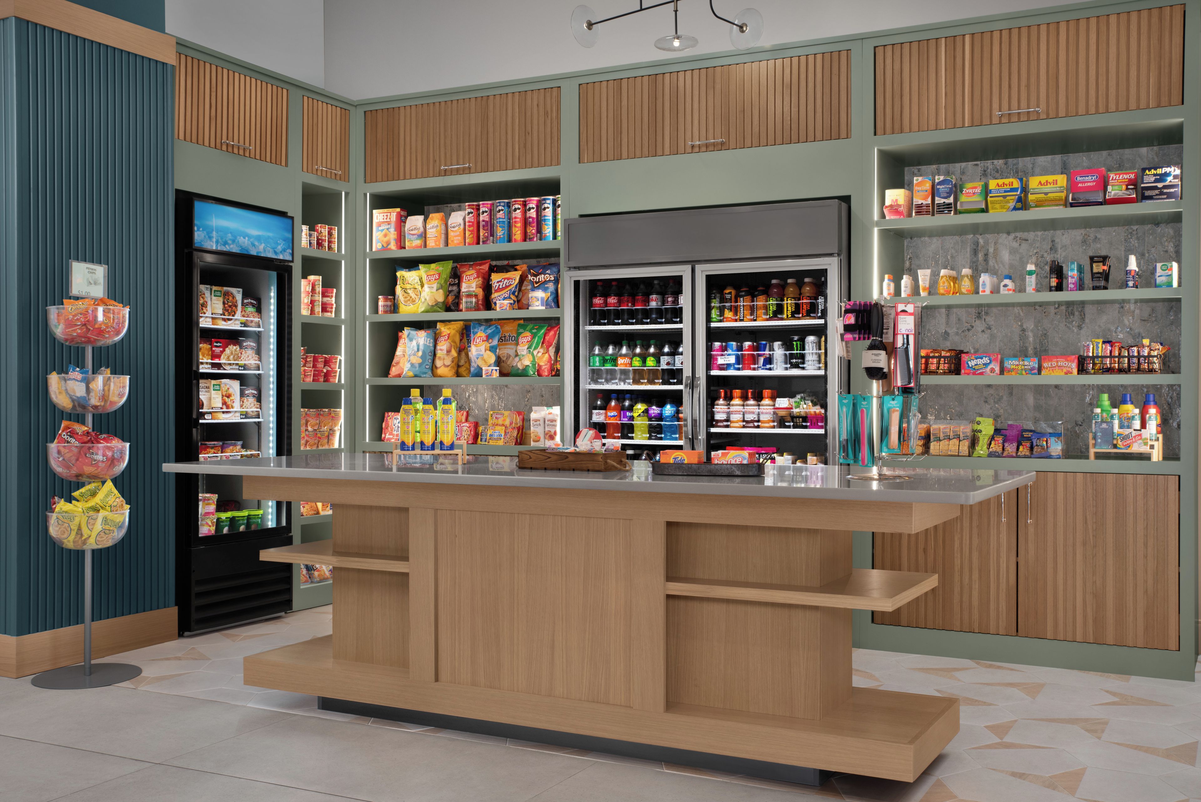 A snack bar with a variety of food items and beverages, including chips, snacks, and drinks.